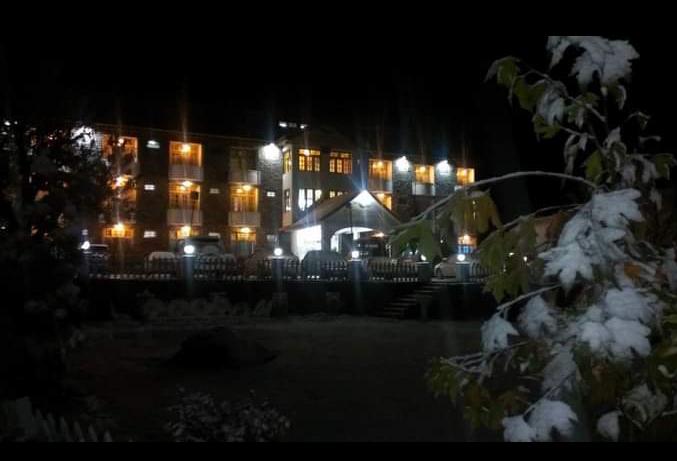 Hotel in Naran Valley with Lsuh Green Mountain in the Background in night - Rozefs Tourism