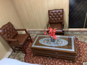 Chairs & table in room of hotel in Rupal Valley Astore - Rozefstourism