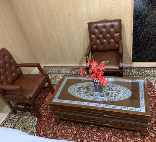 Chairs & table in room of hotel in Rupal Valley Astore - Rozefstourism
