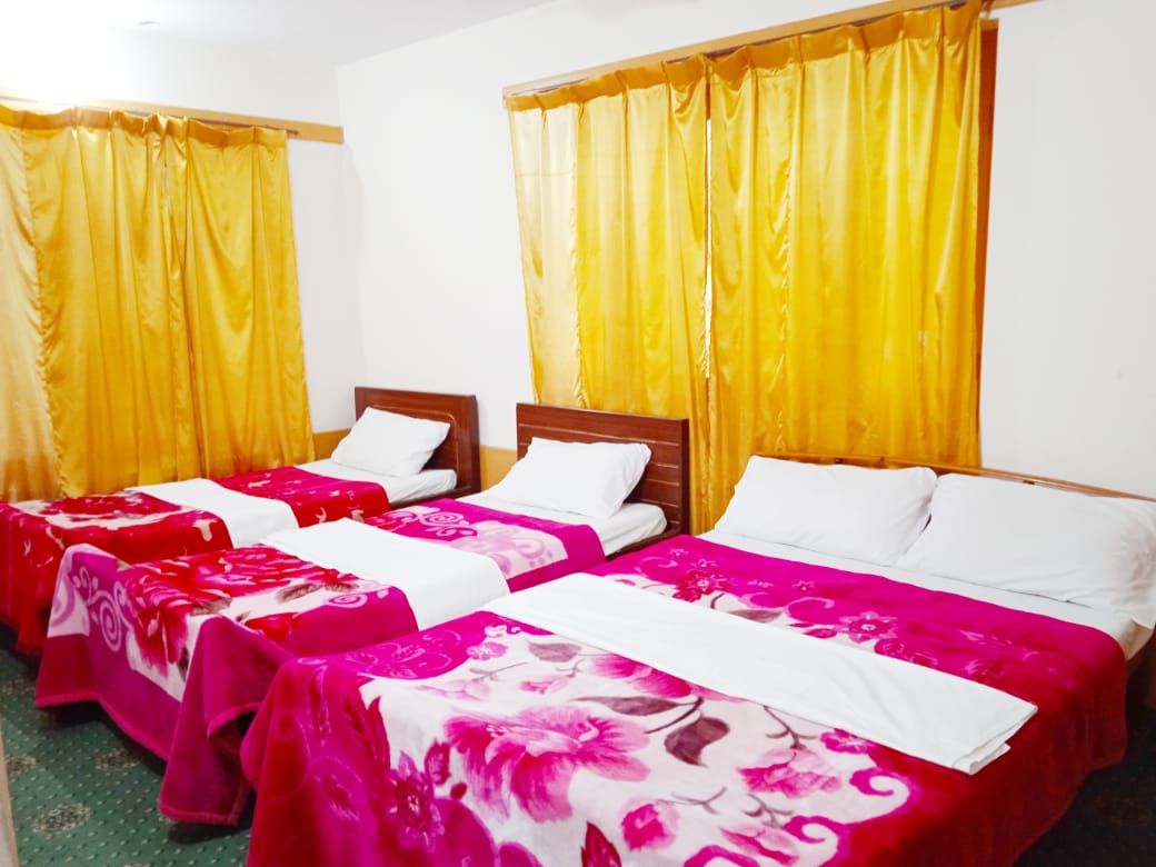 Hotel in Skardu room with three beds for four persons