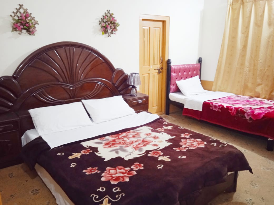Room of the hotel in skardu with two beds