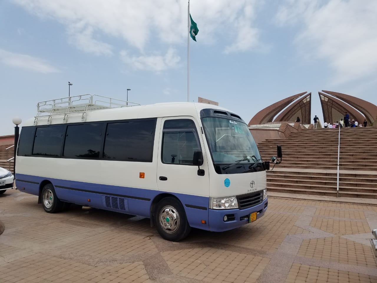 Rozefs Tourism with Tourists in Islamabad at Pakistan Monument in Toyota Coaster