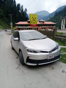 White Silver Black Toyota Corolla available for rent in Islamabad and Hunza Gilgit for Hunza valley tour